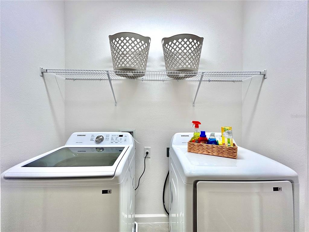 6271 Sand Skipper Road Orlando, FL 32821 - Photo 40 of 46 a utility room with dryer and washer