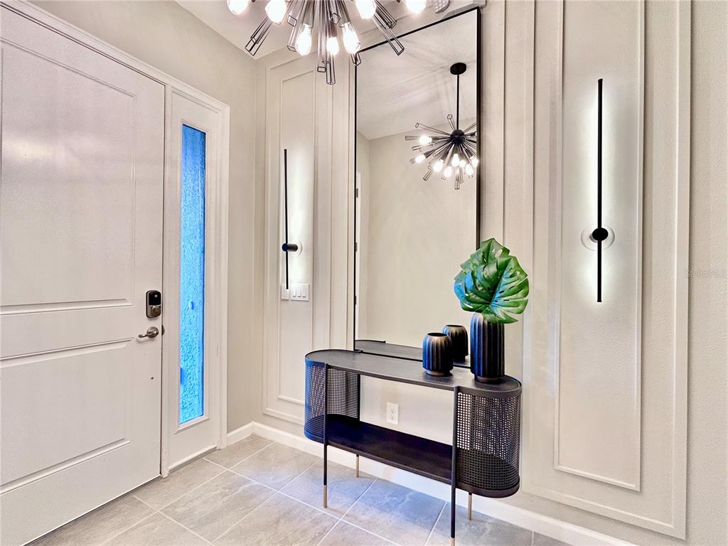 6271 Sand Skipper Road Orlando, FL 32821 - Photo 6 of 46 a living room with furniture and a potted plant