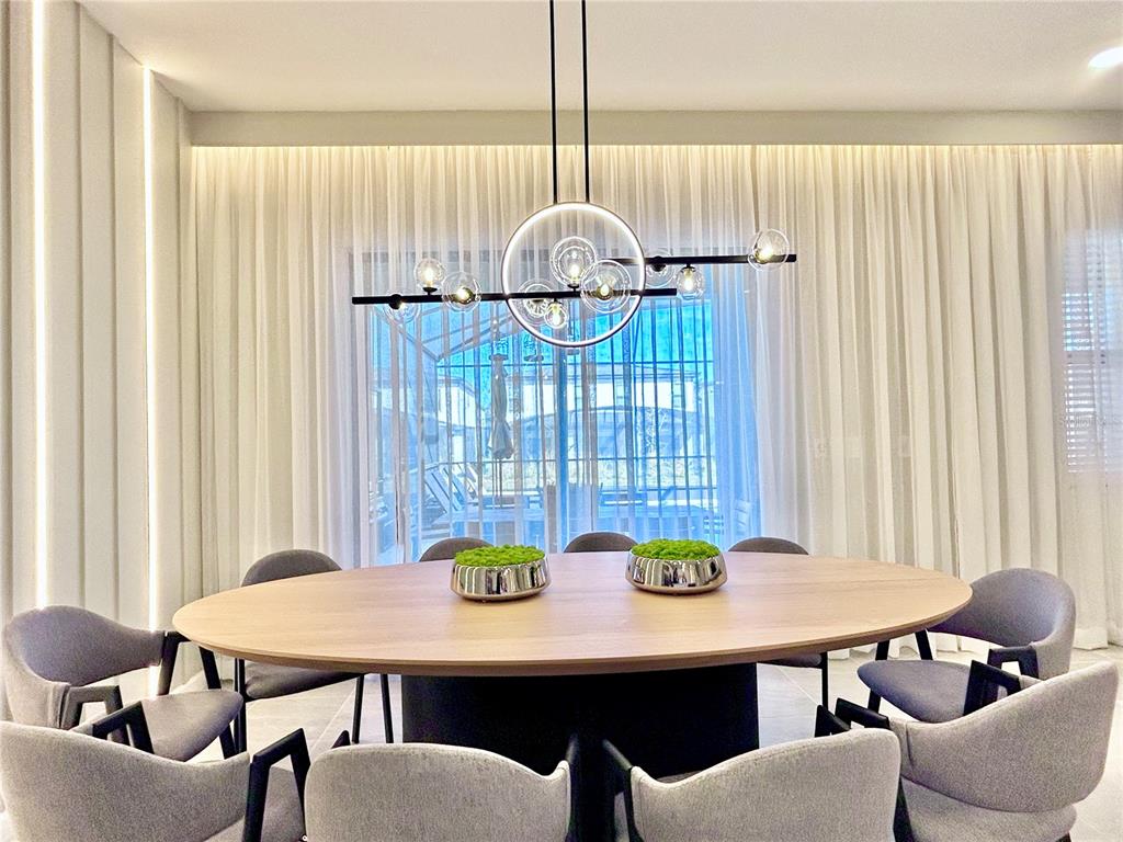 6271 Sand Skipper Road Orlando, FL 32821 - Photo 9 of 46 a view of a dining room with furniture and window