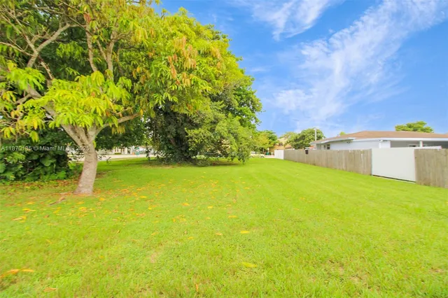 a view of a back yard with a chair