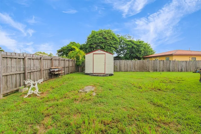 a bed room with a bed and a chair