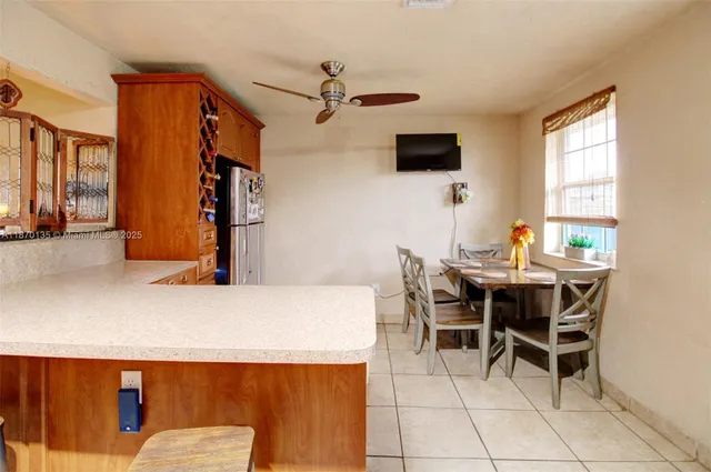 a dining room with furniture and window