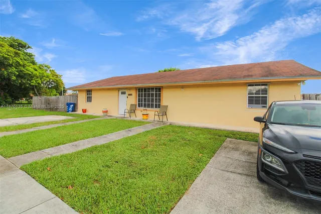 a swimming pool with an outdoor space and seating area
