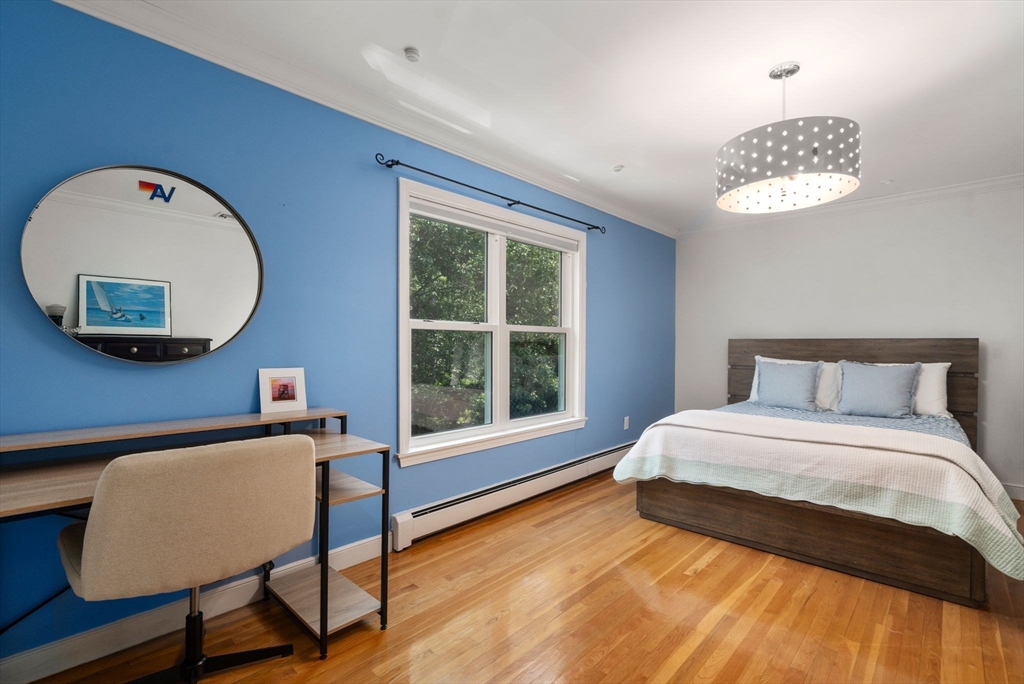 24 Russett Hill Road Sherborn, MA 01770 - Photo 23 of 39 a spacious bedroom with a bed and a window