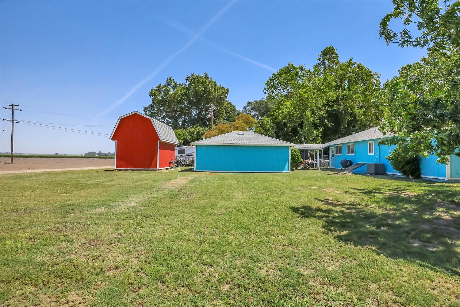 39640 South River Road Clarksburg, CA 95612 - Photo 23 of 25 a view of an house with backyard space and a tree