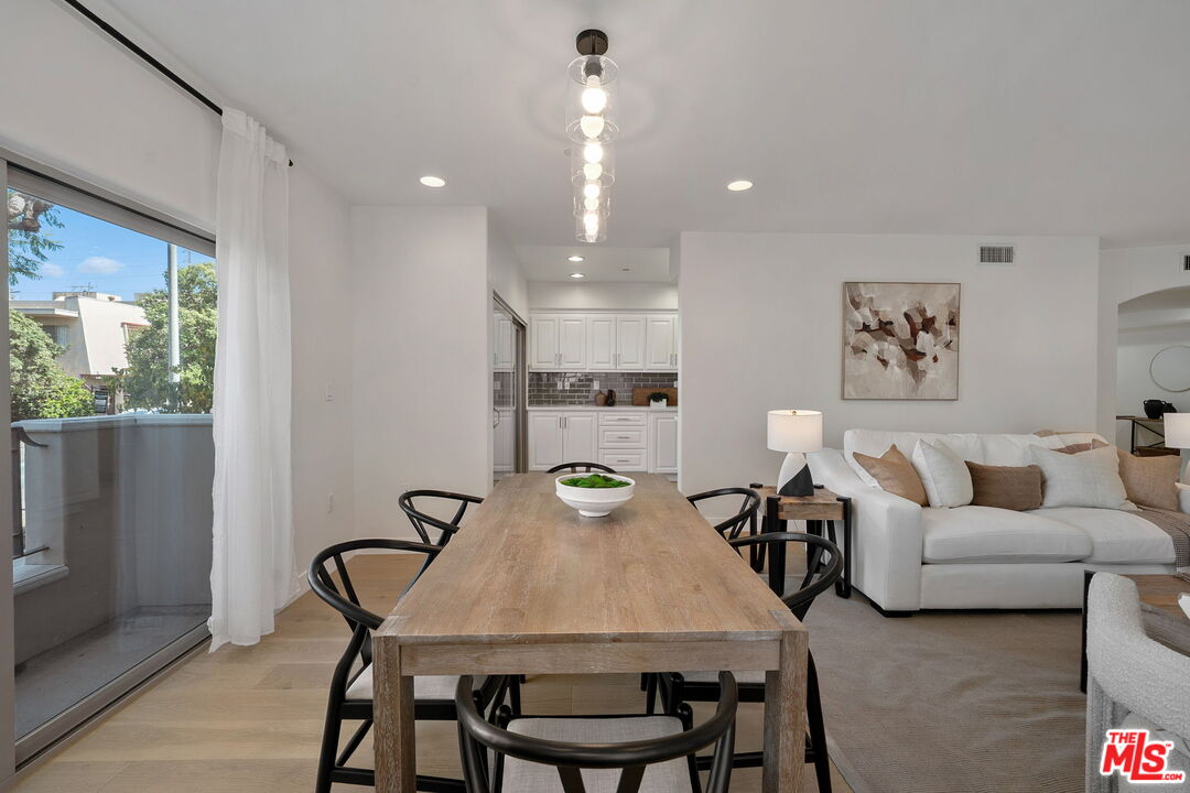 1629 Armacost Avenue, Unit 101 Los Angeles, CA 90025 - Photo 11 of 26 a view of a dining room with furniture