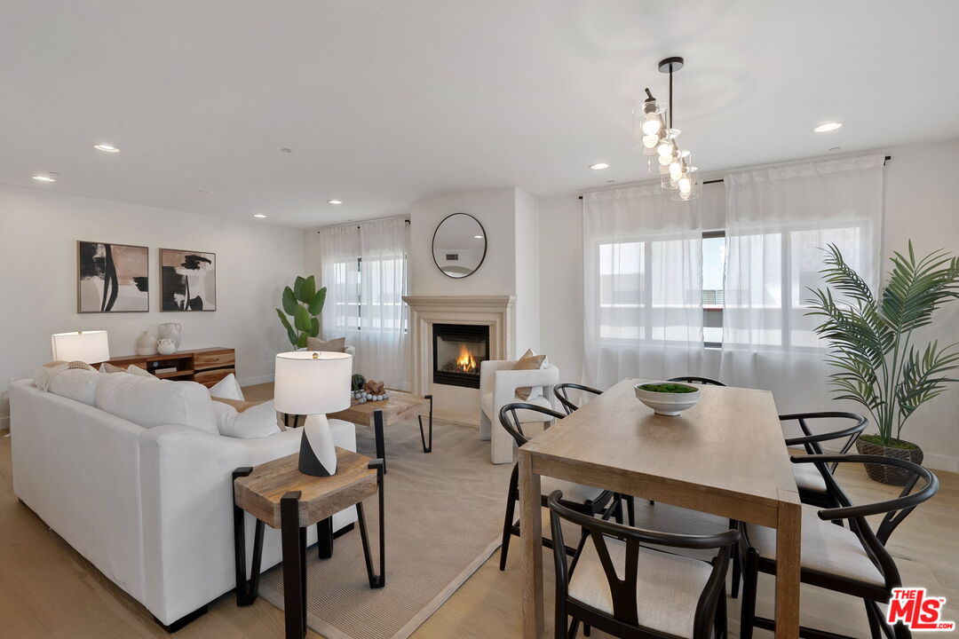 1629 Armacost Avenue, Unit 101 Los Angeles, CA 90025 - Photo 12 of 26 a view of a dining room with furniture and wooden floor