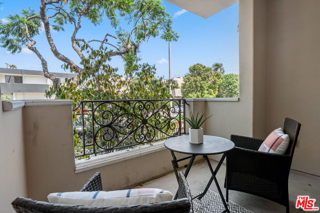 1629 Armacost Avenue, Unit 101 Los Angeles, CA 90025 - Photo 16 of 26 a view of a dining room with furniture window and wooden floor