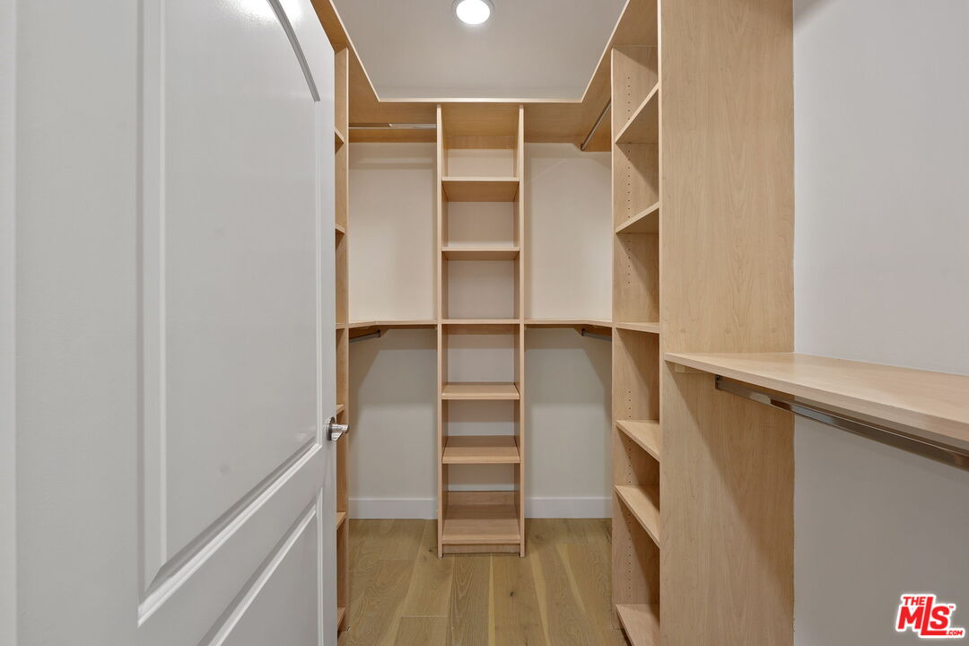 1629 Armacost Avenue, Unit 101 Los Angeles, CA 90025 - Photo 19 of 26 a view of walk in closet with empty racks