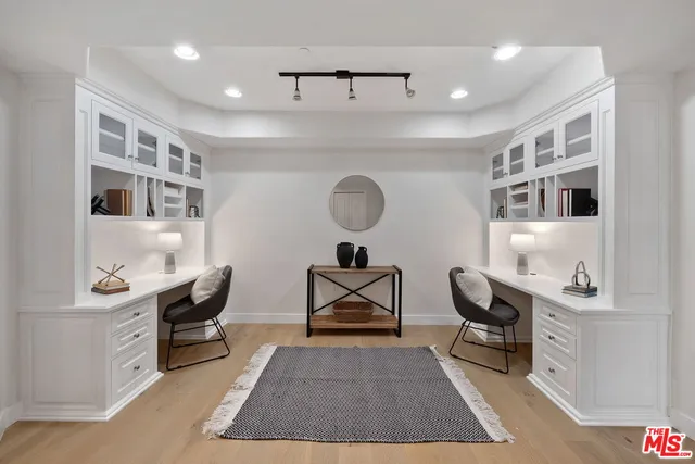 a living room with furniture a rug and a table