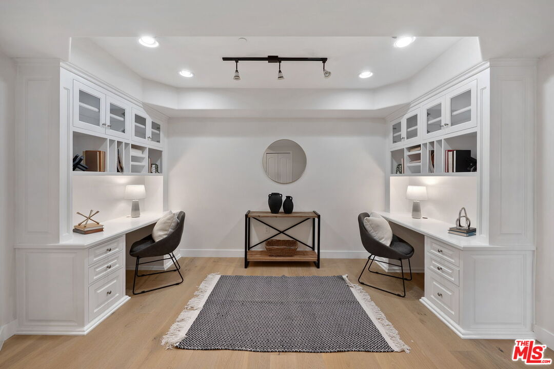 1629 Armacost Avenue, Unit 101 Los Angeles, CA 90025 - Photo 4 of 26 a living room with furniture a rug and a table