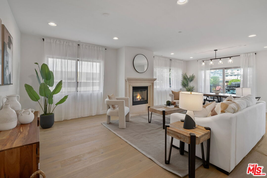 1629 Armacost Avenue, Unit 101 Los Angeles, CA 90025 - Photo 5 of 26 a living room with furniture fireplace and window