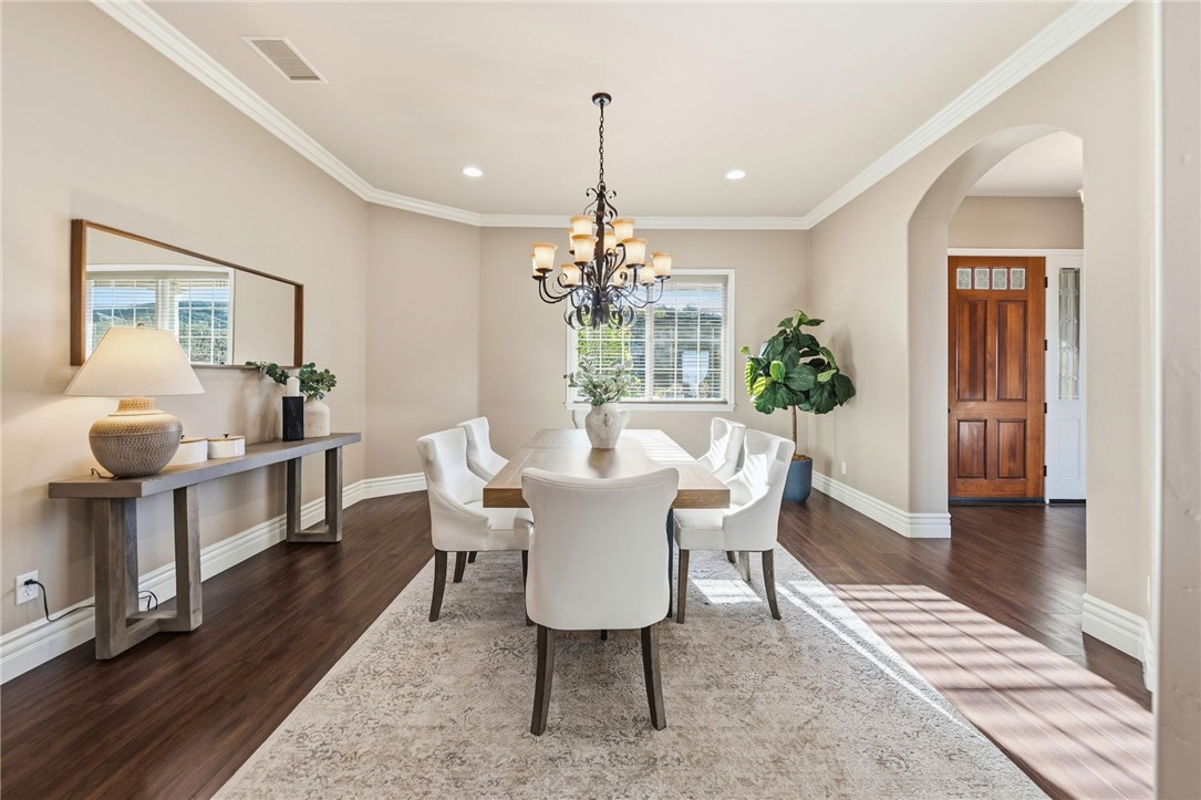 40267 Scanlon Road Temecula, CA 92592 - Photo 12 of 68 a dining room with furniture a chandelier and wooden floor