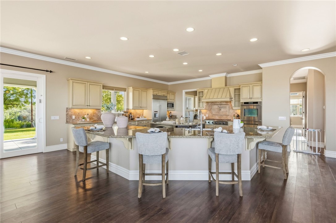 40267 Scanlon Road Temecula, CA 92592 - Photo 22 of 68 a large dining space with furniture window and wooden floor