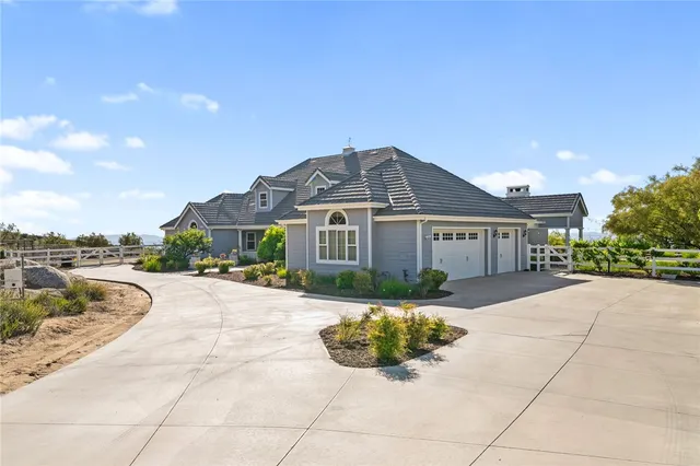 a room with furniture and view of kitchen