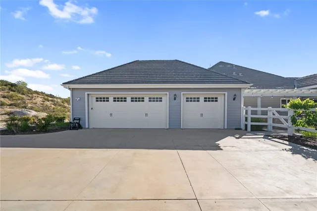 a kitchen with granite countertop cabinets a sink and dishwasher