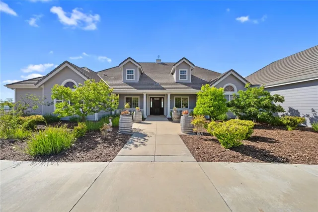 a large kitchen with stainless steel appliances kitchen island granite countertop a lot of counter space and a sink