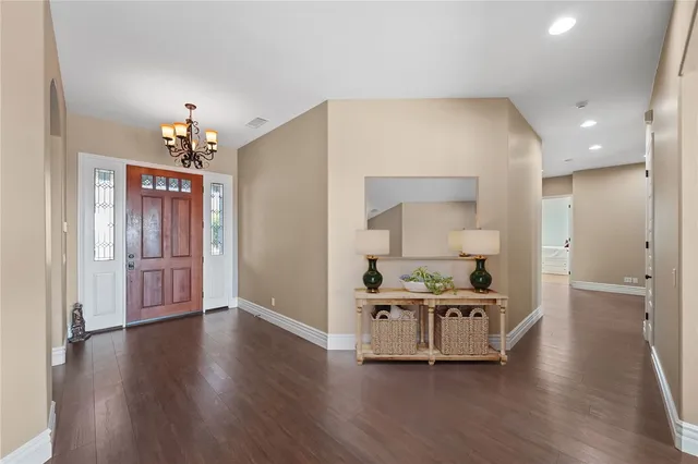 a large kitchen with stainless steel appliances granite countertop a stove and a sink