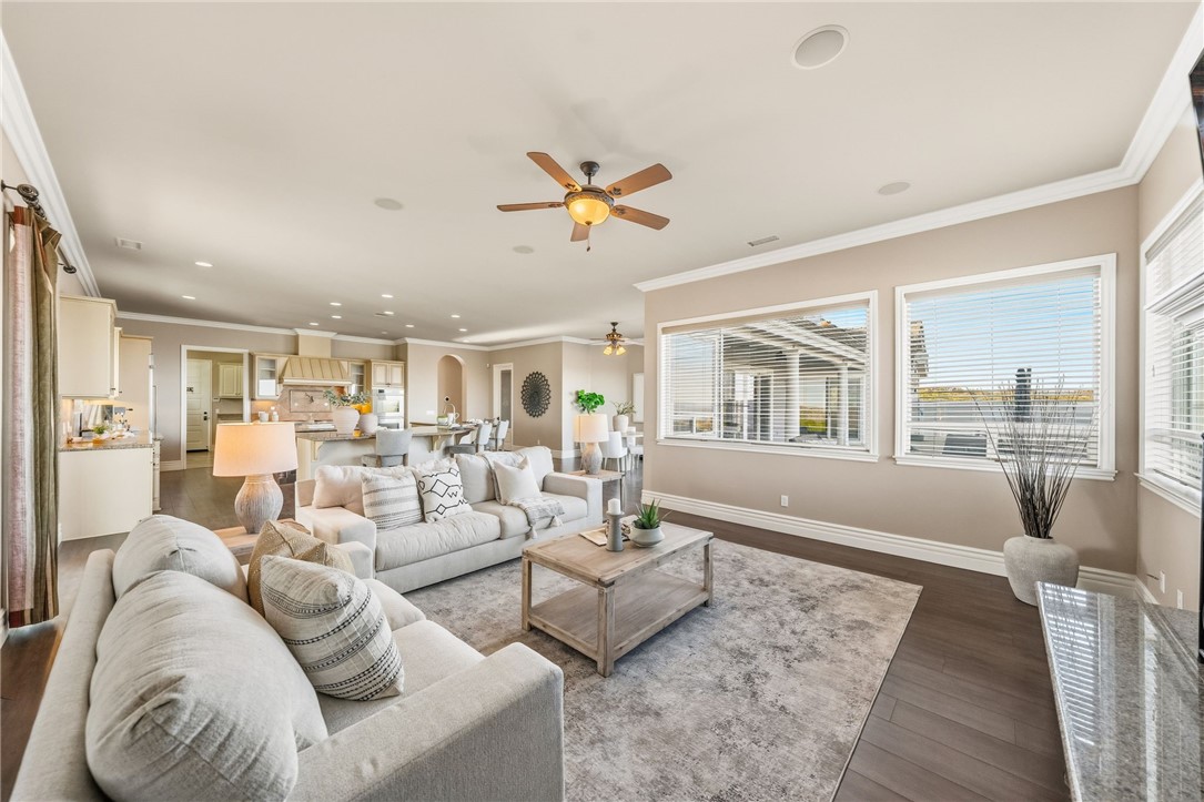 40267 Scanlon Road Temecula, CA 92592 - Photo 36 of 68 a living room with furniture ceiling fan and a rug