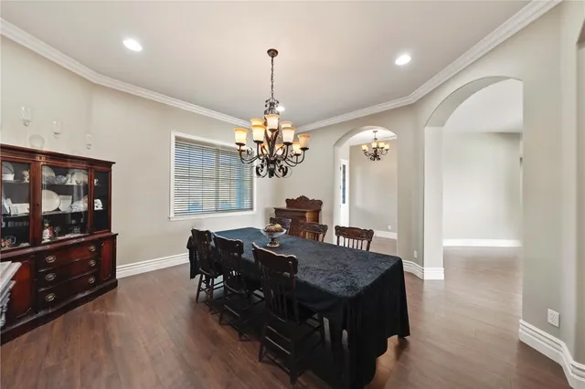 a bedroom with a bed and a television