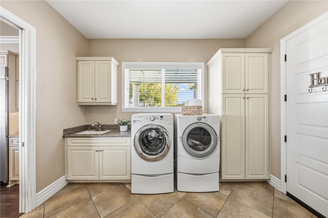40267 Scanlon Road Temecula, CA 92592 - Photo 39 of 68 a utility room with sink dryer and washer