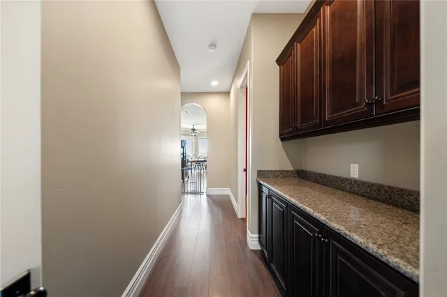 a large kitchen with a wooden cabinets and a stove top oven