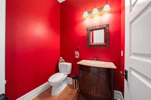 a view of a patio with table and chairs and a large tree