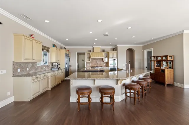a view of a house with a yard and sitting area