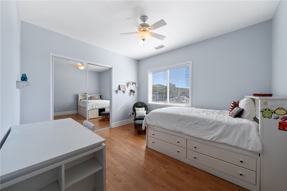 40267 Scanlon Road Temecula, CA 92592 - Photo 58 of 68 a bedroom with a bed and a chandelier