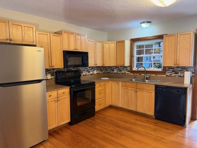 13 Williams Street, Unit C St. Augustine, FL 32084 - Photo 3 of 8 a kitchen with granite countertop a refrigerator stove top oven and sink