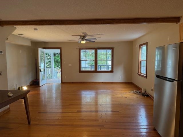 13 Williams Street, Unit C St. Augustine, FL 32084 - Photo 4 of 8 an empty room with wooden floor and windows