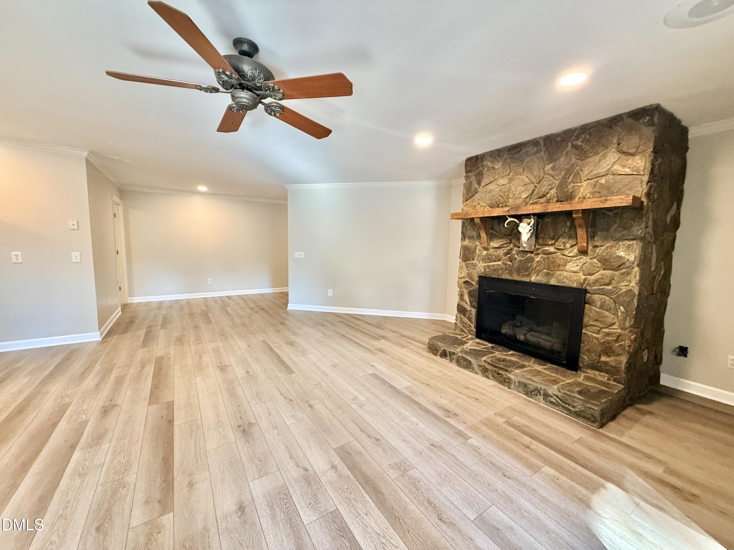 81 Beaver Crossing Road Roxboro, NC 27574 - Photo 45 of 80 wooden floor in an empty room with a fireplace