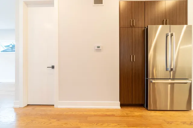 a view of a kitchen with wooden floor