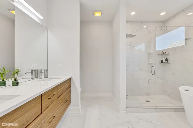 a bathroom with a shower sink and mirror