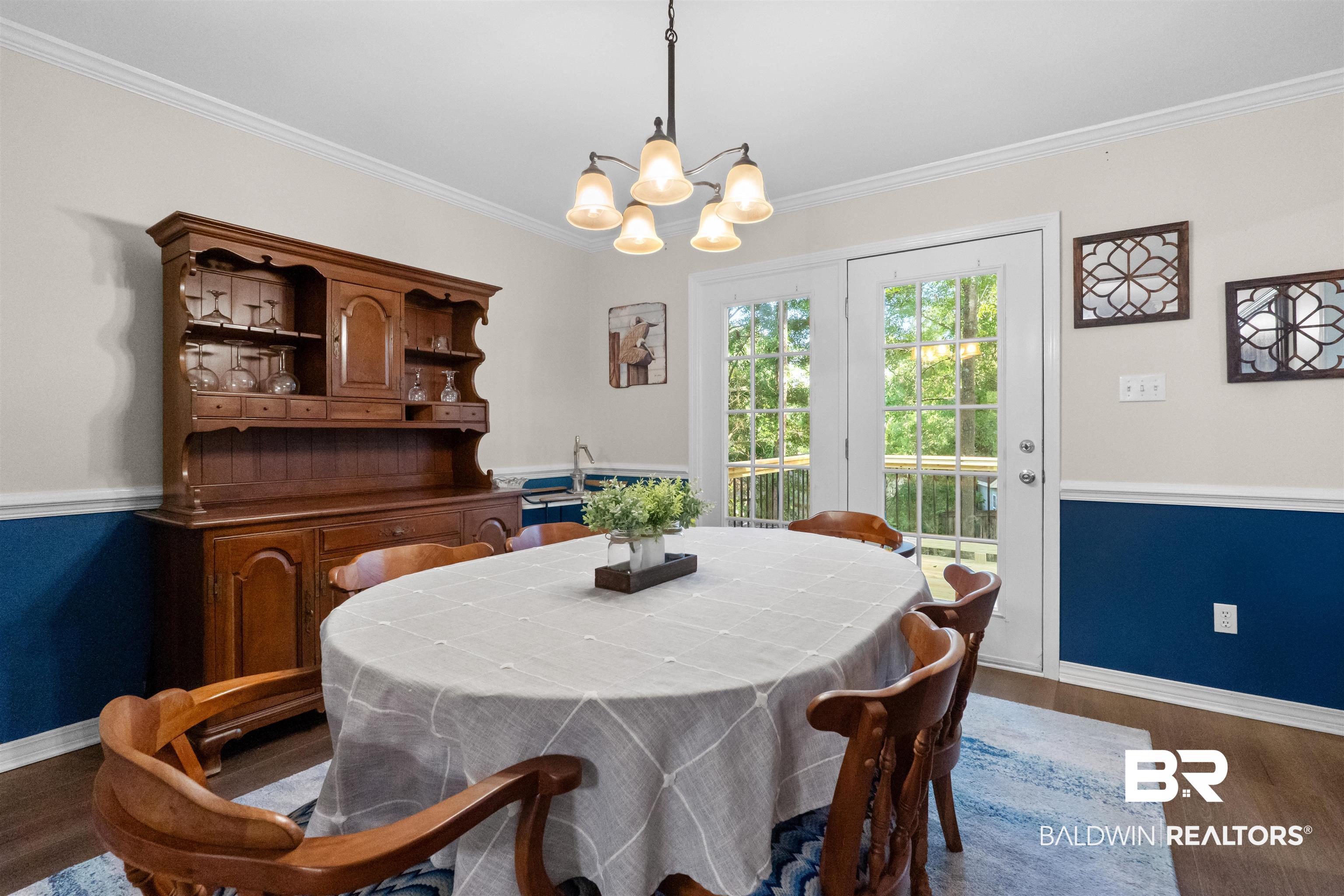 153 Lakeview Loop Daphne, AL 36526 - Photo 17 of 56 French doors invite natural light inside while offering easy access to the outdoor spaces beyond.