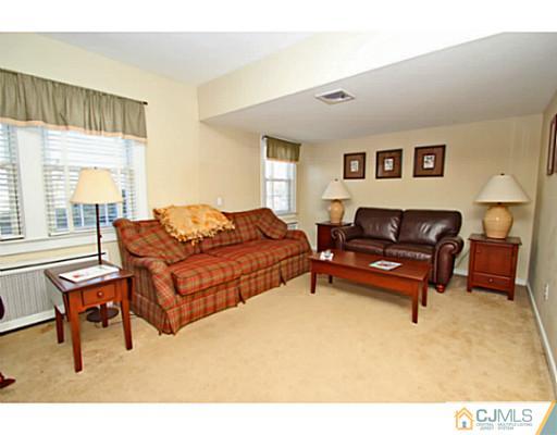 33 Edgewood Road Edison, NJ 08820 - Photo 14 of 25 a living room with furniture and a window