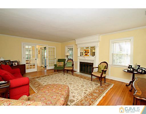 33 Edgewood Road Edison, NJ 08820 - Photo 3 of 25 a living room with furniture rug and window