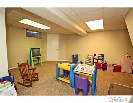 33 Edgewood Road Edison, NJ 08820 - Photo 22 of 25 a room with furniture and air hockey table