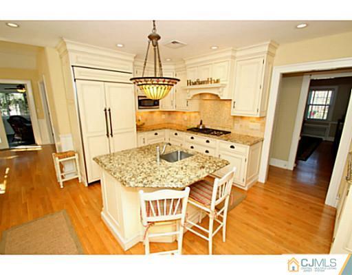 33 Edgewood Road Edison, NJ 08820 - Photo 8 of 25 a view of a dining room with furniture and wooden floor