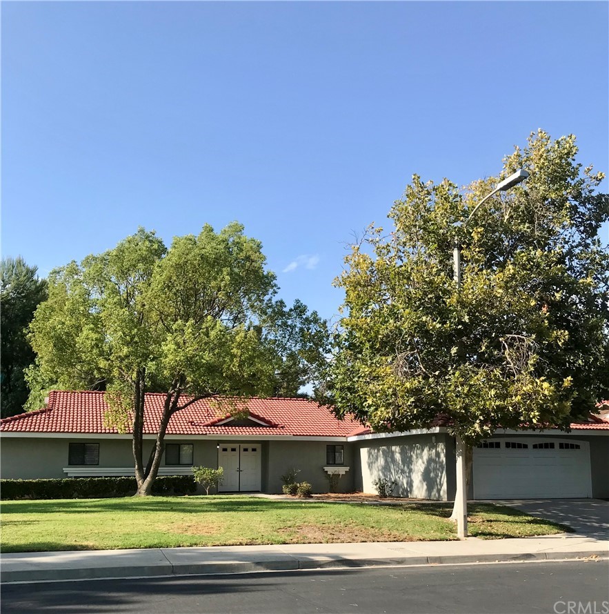 21050 Vandenberg Riverside, CA 92518 - Photo 1 of 24 a view of a big house with a big yard and large trees