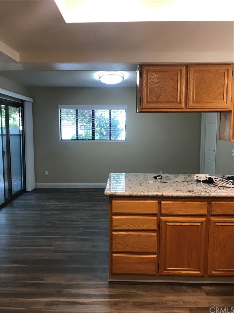 21050 Vandenberg Riverside, CA 92518 - Photo 4 of 24 a view of kitchen cabinets and wooden floor