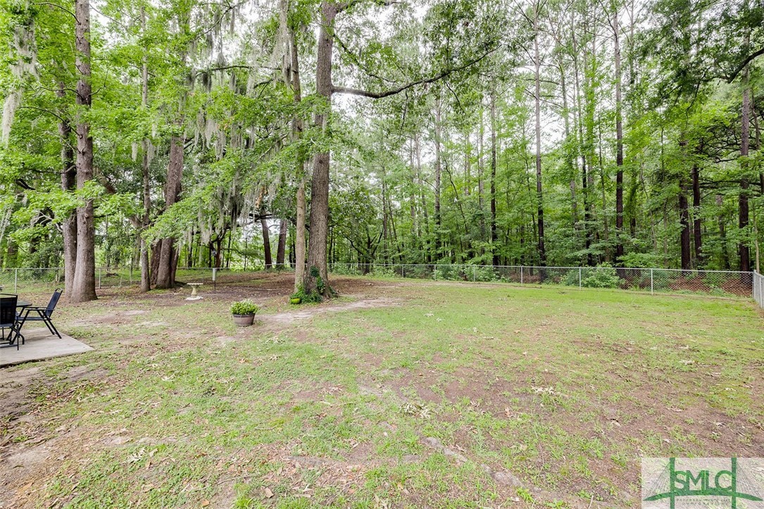613 Ryan Lane Pooler, GA 31322 - Photo 15 of 19 Wooded area behind house
