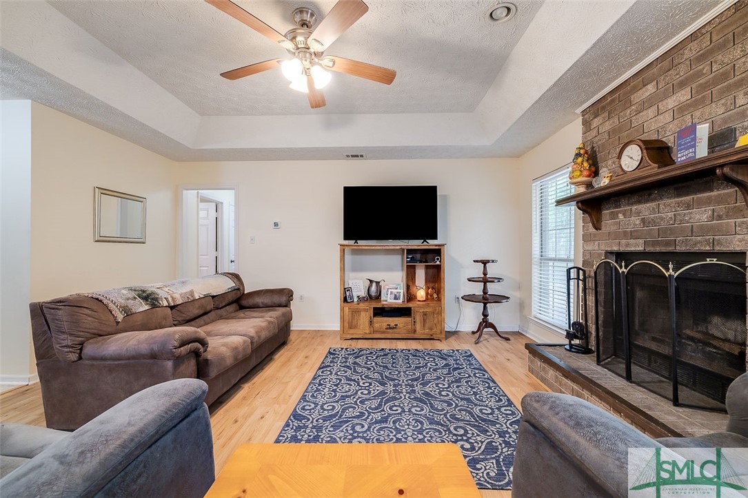 613 Ryan Lane Pooler, GA 31322 - Photo 4 of 19 Masonry fireplace and tray ceiling