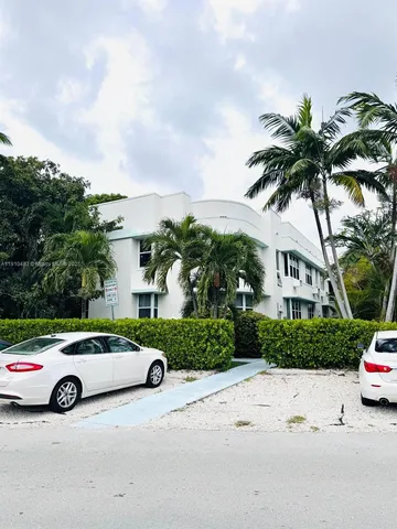a view of a car parked in front of a house