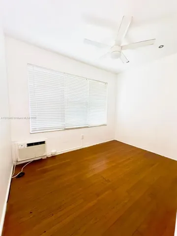 an empty room with a empty space and a window