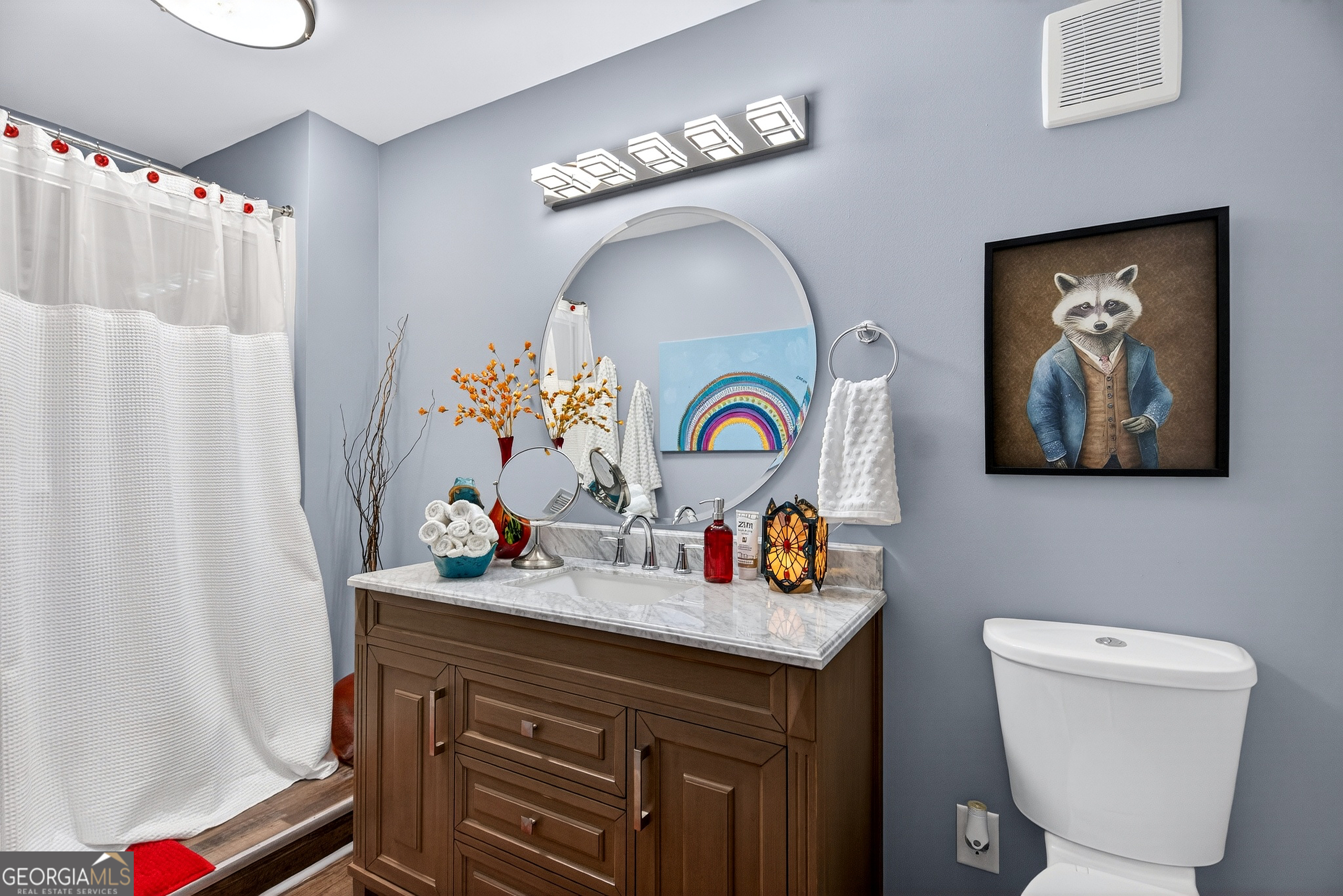 123 South Smith Road LaGrange, GA 30241 - Photo 27 of 67 a bathroom with a toilet a sink and a mirror