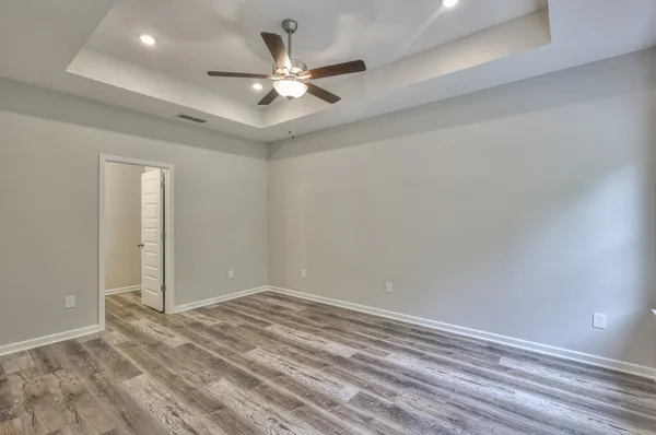 a view of a room with a ceiling fan