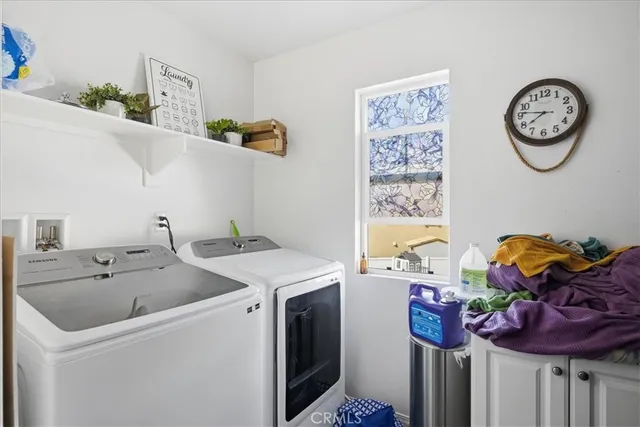 a view of storage and utility room with a sink and toys