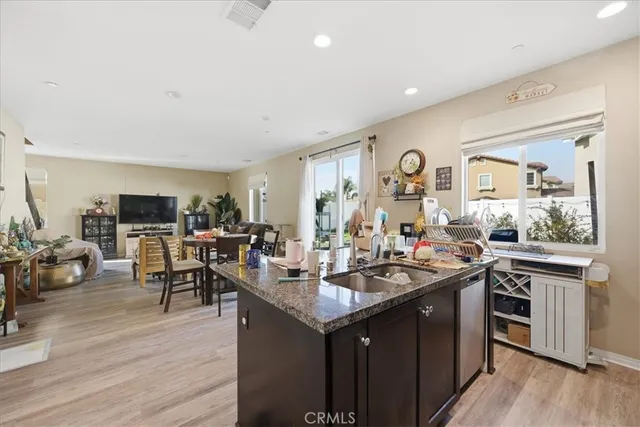 a kitchen with sink and cabinets