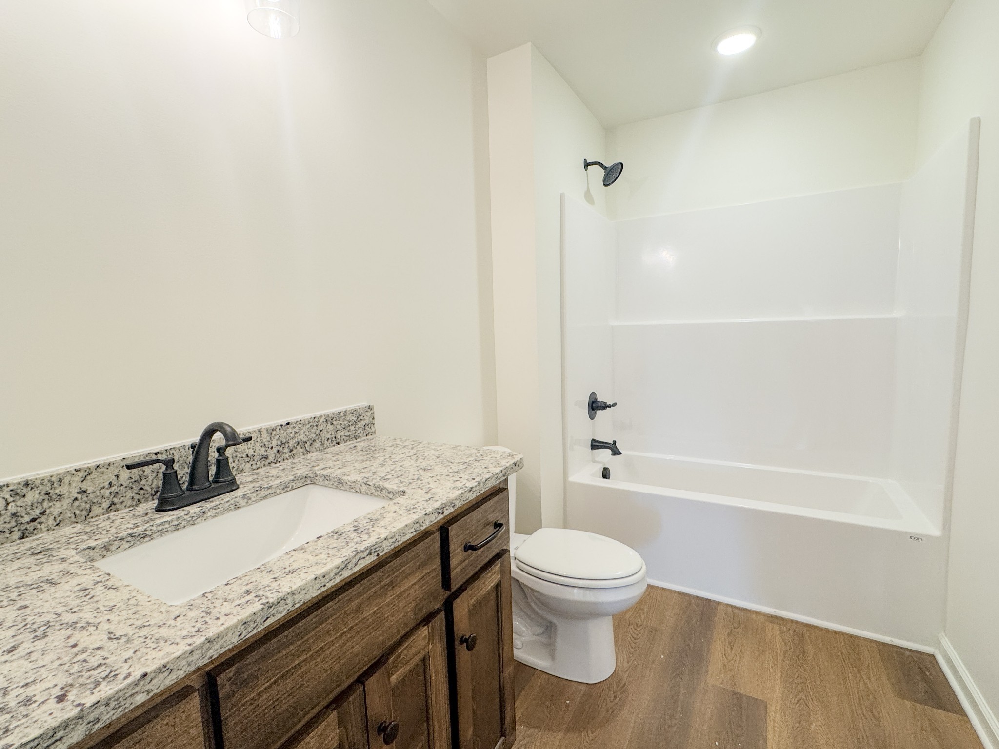 575 Pleasant Hill Road Lafayette, TN 37083 - Photo 24 of 51 a bathroom with a granite countertop sink a toilet and shower